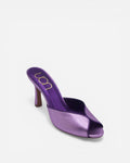 Purple high-heeled shoe on a white background