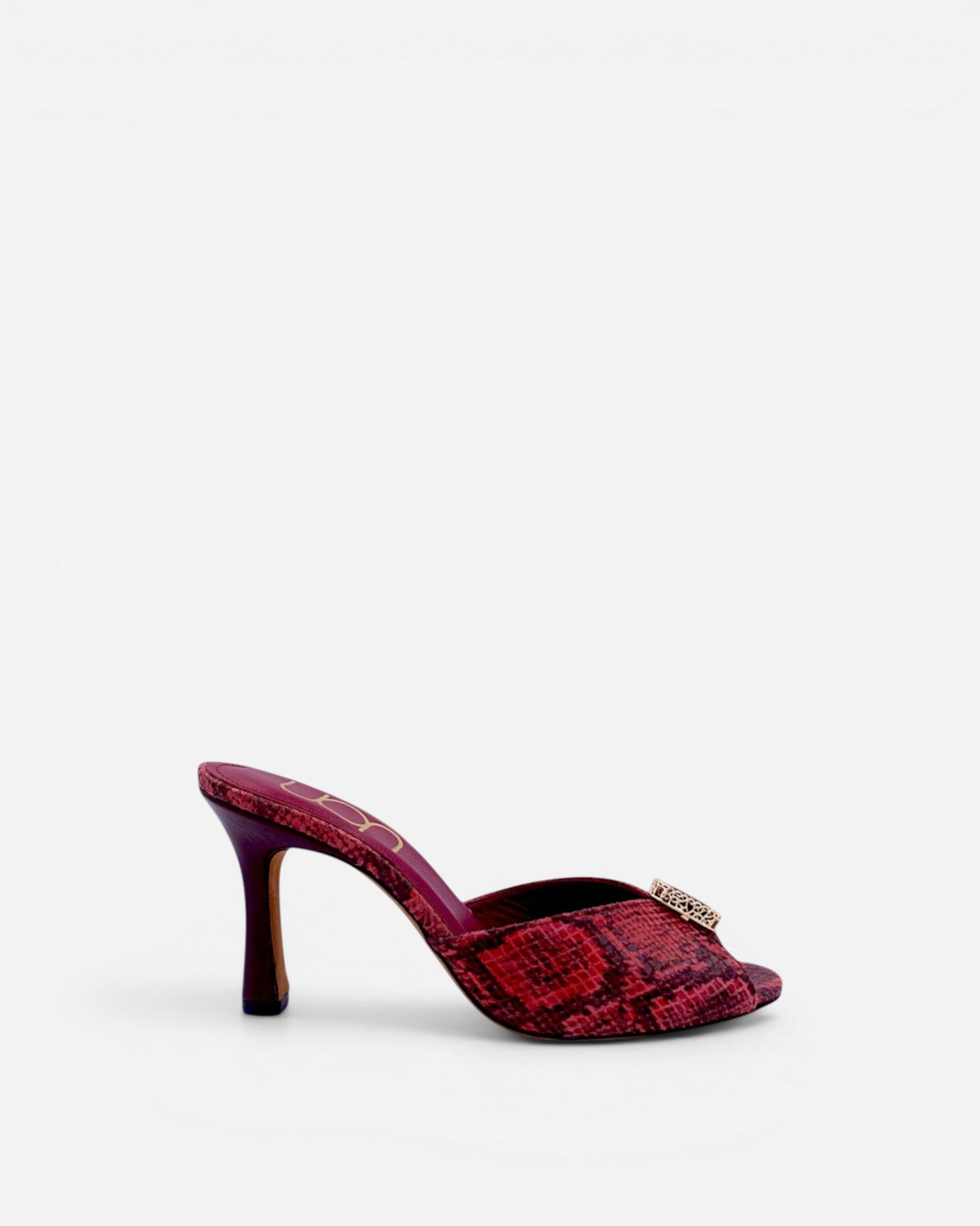 NOU red snakeskin leather mule heels with ruby gemstone accent and stiletto heel.