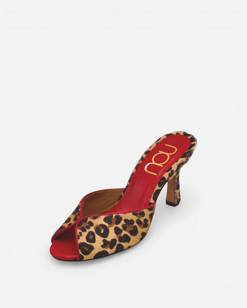 Red high-heeled shoe with leopard print and 'nou' branding on a white background