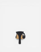 Black high-heeled shoe on a white background