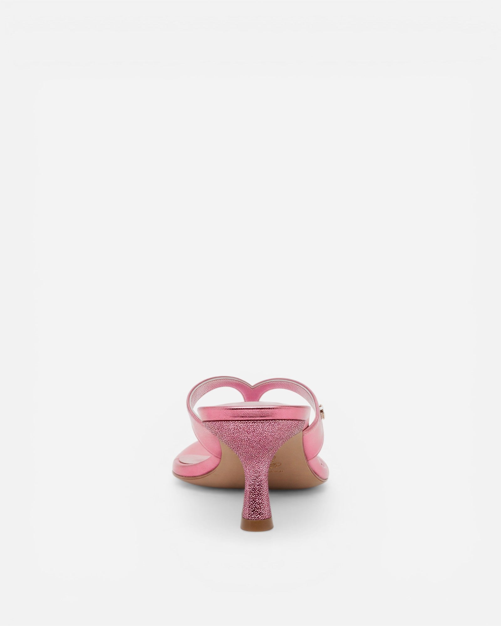 Pink high-heeled shoe with a heart design on a white background