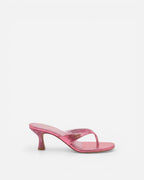 Pink high-heeled sandal on a white background