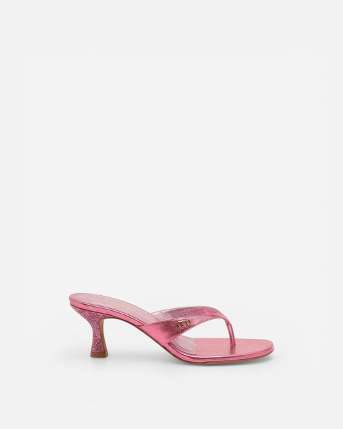 Pink high-heeled sandal on a white background