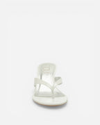 White sandal on a light beige background