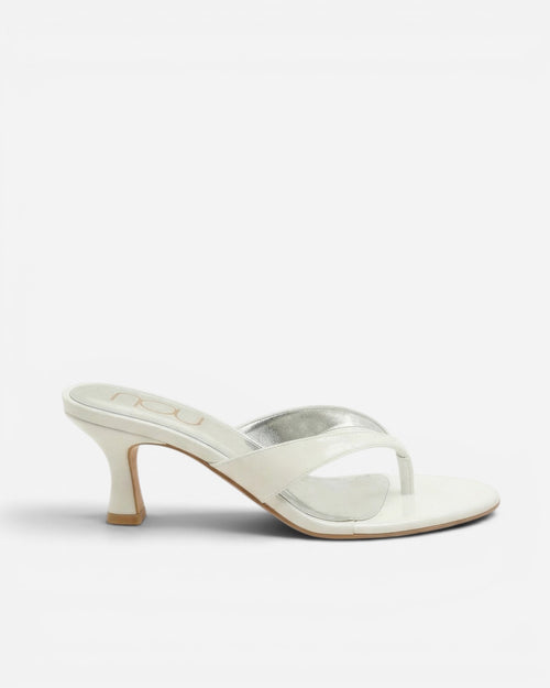 White high-heeled sandal on a white background