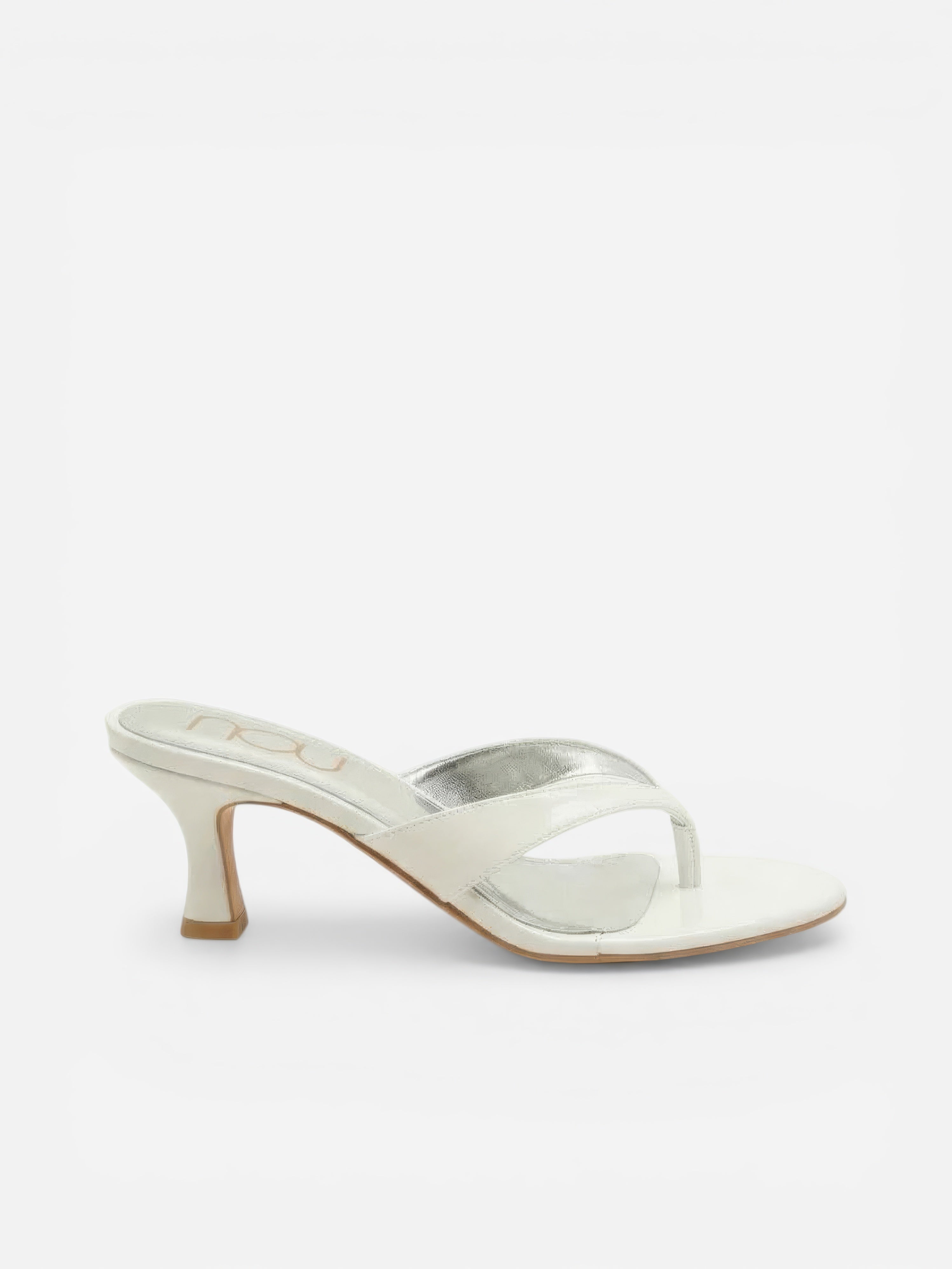White high-heeled sandal with clear strap on a white background