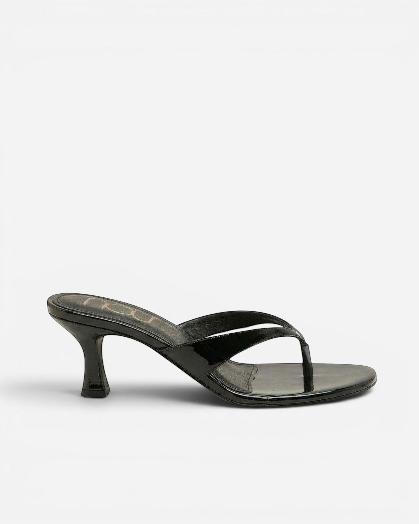 NOU The Kitty black patent leather kitten heel thong sandal with a 1.5 inch sculpted heel and padded insole.