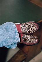 NOU The Driver loafers in burgundy leather with leopard print ponyhair worn with blue jeans and burgundy socks