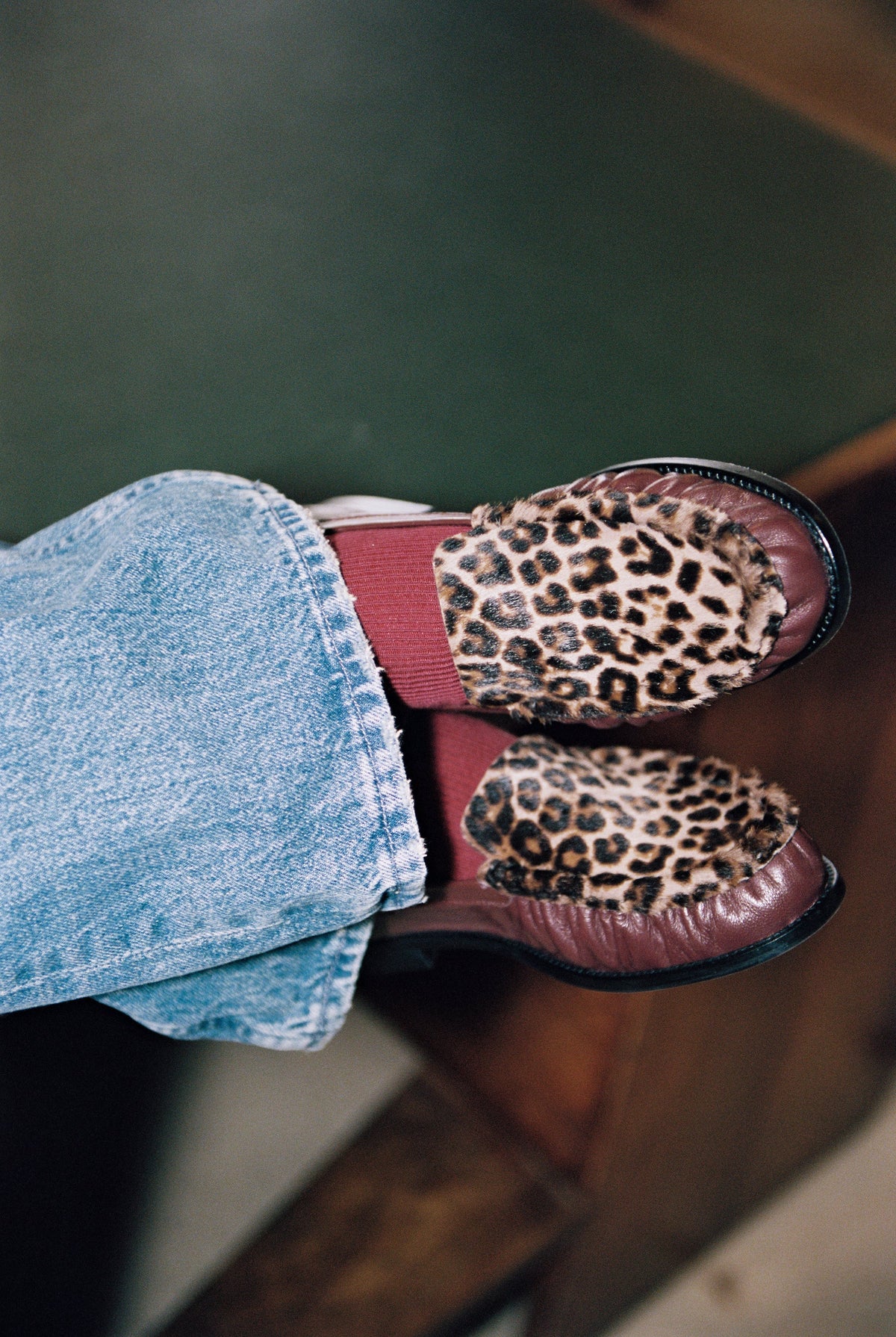NOU The Driver loafers in burgundy leather with leopard print ponyhair worn with blue jeans and burgundy socks