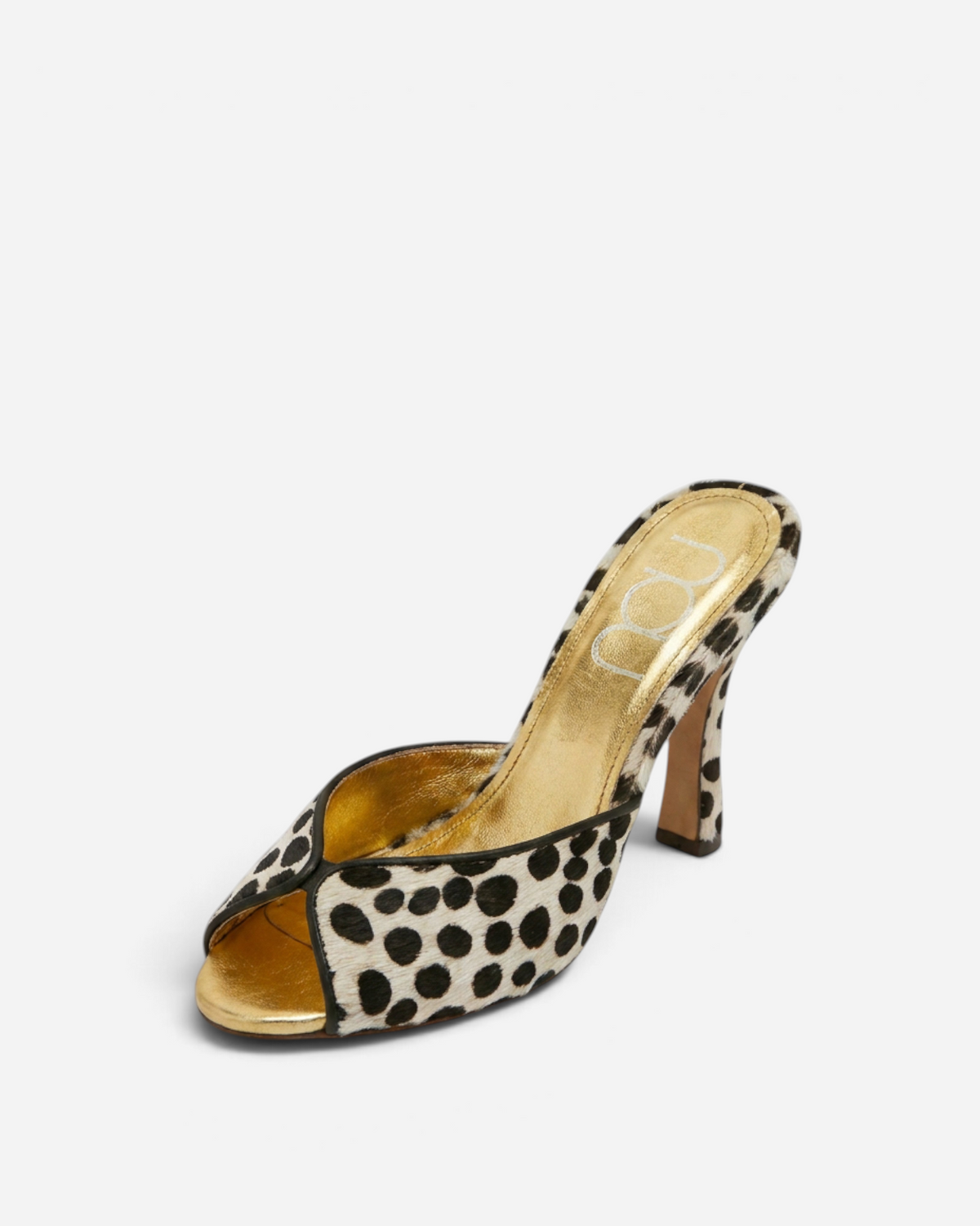 NOU The Mule in dalmatian print ponyhair with a metallic gold insole and open-toe high heel design.