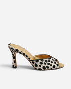 NOU The Mule in dalmatian print ponyhair with a metallic gold insole and stiletto heel, side profile view.