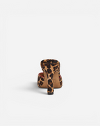 NOU The Mule in leopard print ponyhair with a red interior lining and a slim stiletto heel, back view.