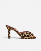 NOU leopard print ponyhair mule with red trim and a sculpted heel.