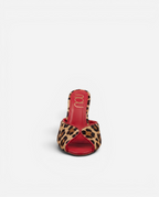 NOU The Mule slip-on shoes in leopard print ponyhair with vibrant red leather trim and interior.
