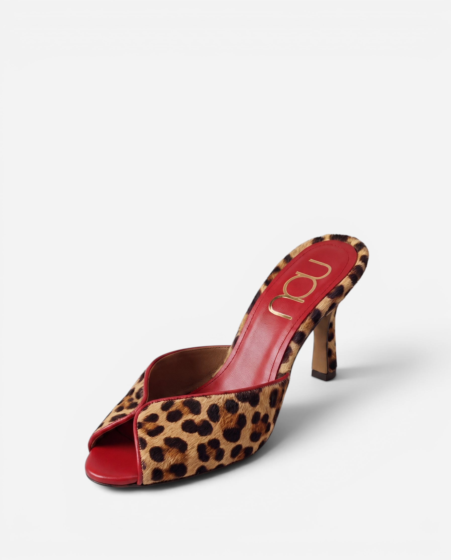 NOU The Mule in leopard print Italian ponyhair with a red leather insole and stiletto heel