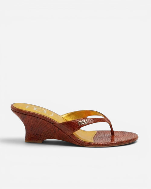 NOU The Puff Wedge in blood orange snakeskin with a 3-inch sculptural heel and marigold cushioned insole.