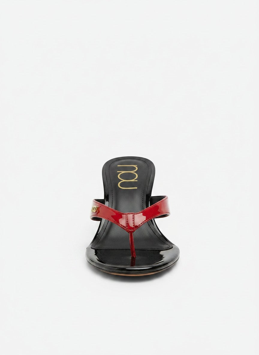 NOU The Puff Wedge patent flip-flop sandals in red and black with a 3" heel and gold logo detail.