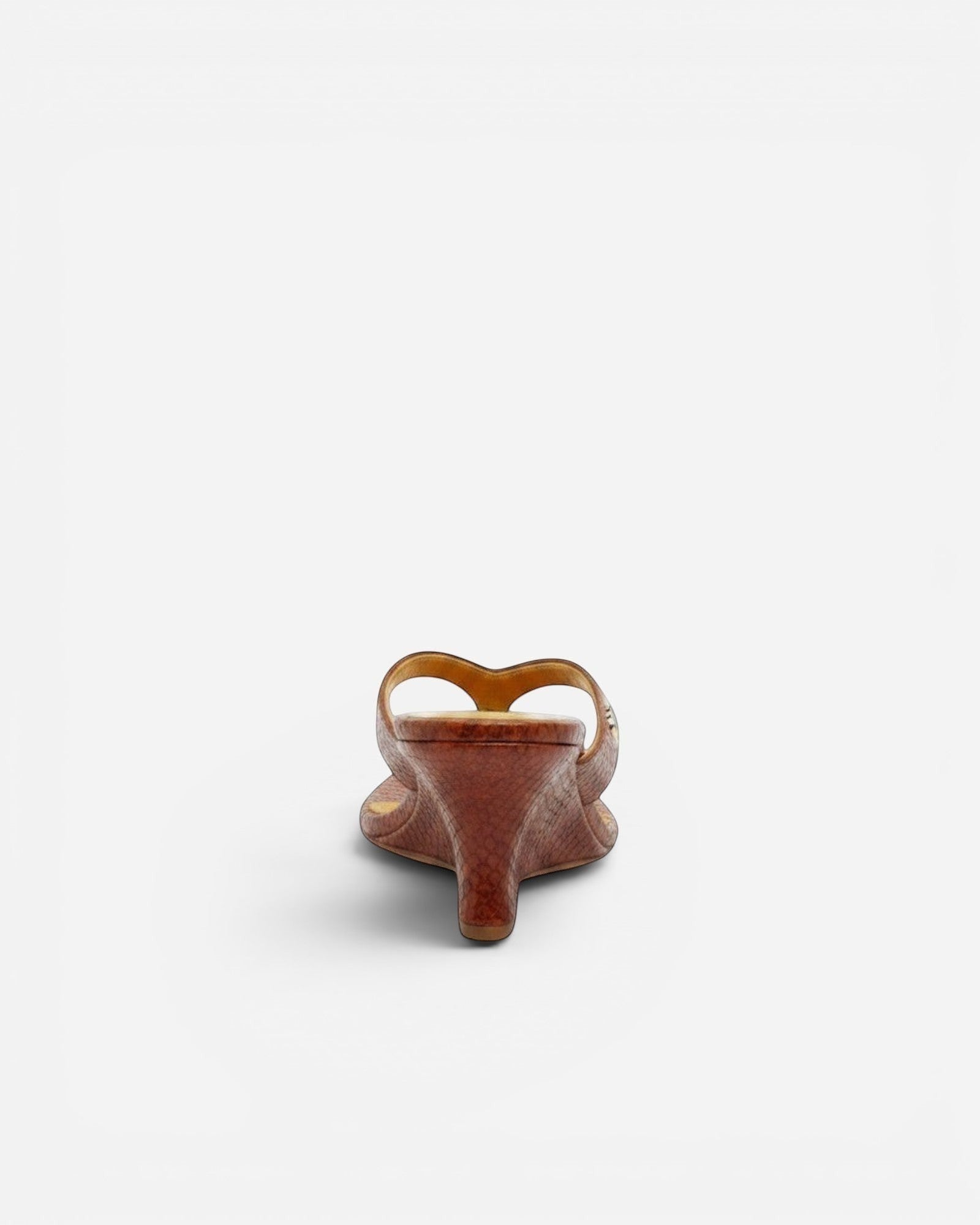NOU The Puff Wedge in blood orange snakeskin with a 3-inch sculptural heel and gold logo detail, back view.