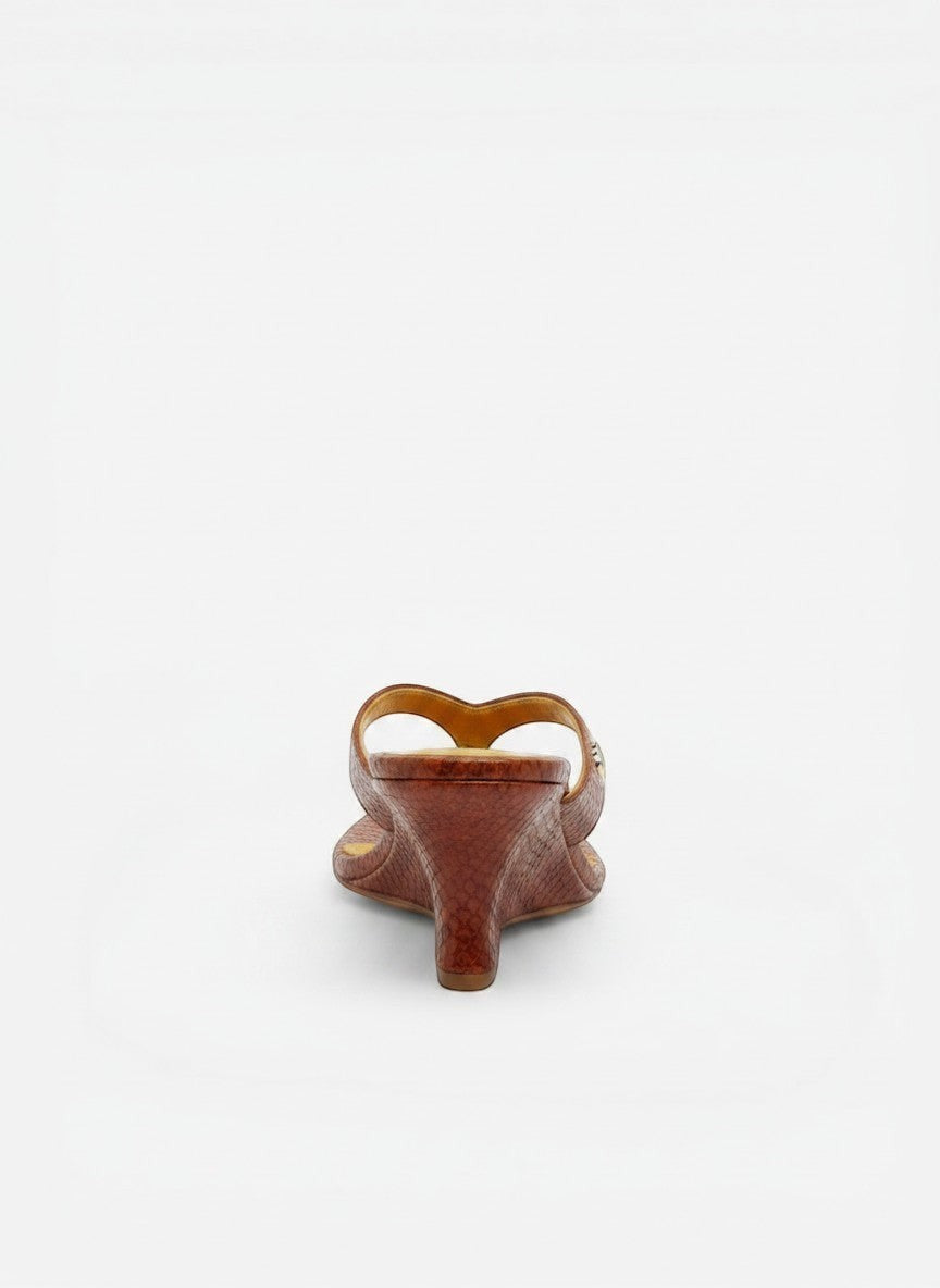 NOU The Puff Wedge sandals in snakeskin print leather with a 3" sculpted wedge heel and plush straps. Citrus colorway.