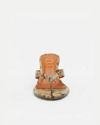 NOU The Puff Wedge in Creamsicle python snakeskin finish with a 3-inch sculptural heel and metallic orange insole.