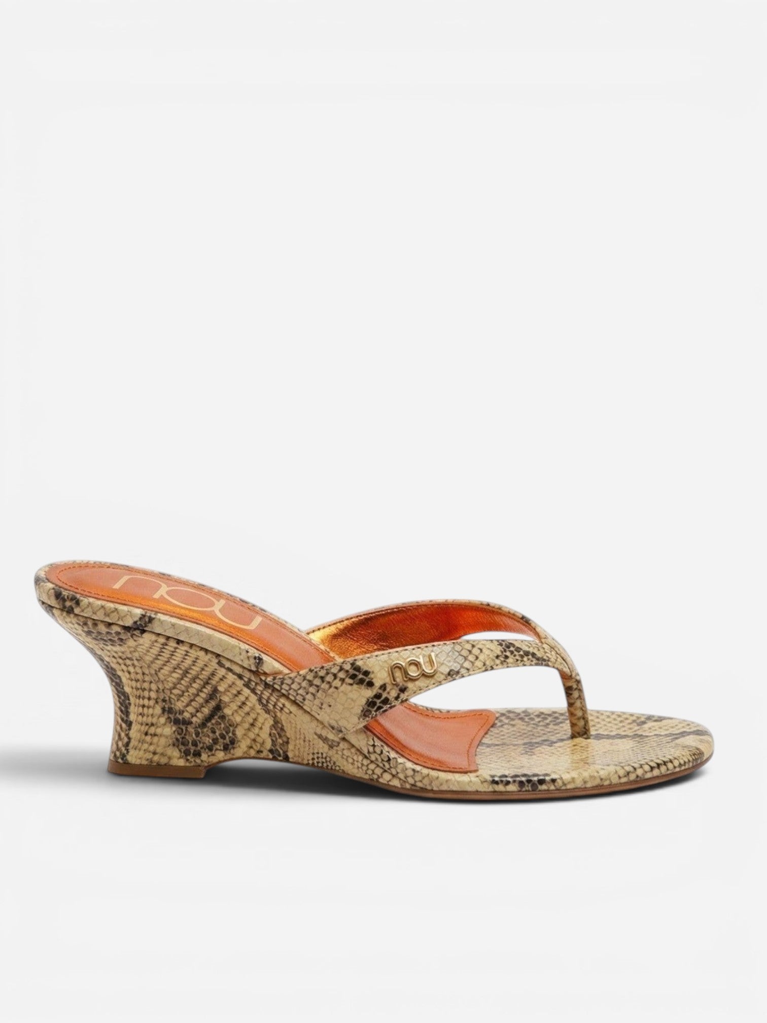 NOU The Puff Wedge in Creamsicle python snakeskin finish with a 3-inch sculptural heel and metallic orange insole.