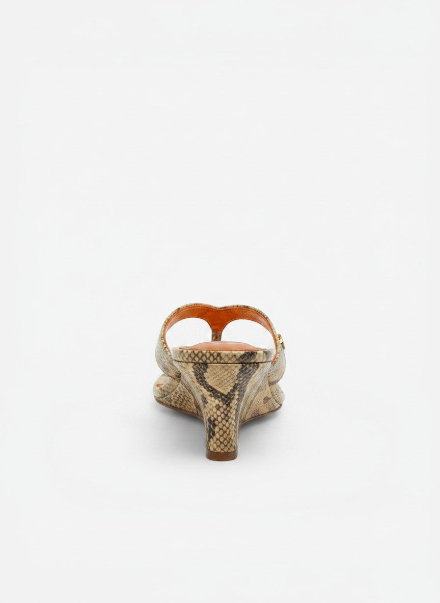 NOU The Puff Wedge sandals with python snakeskin upper and metallic orange insole. Features plush straps and a 3" wedge heel.