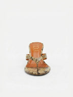 NOU The Puff Wedge thong sandals with python snakeskin upper and 3" sculptural lift. Metallic orange insole.