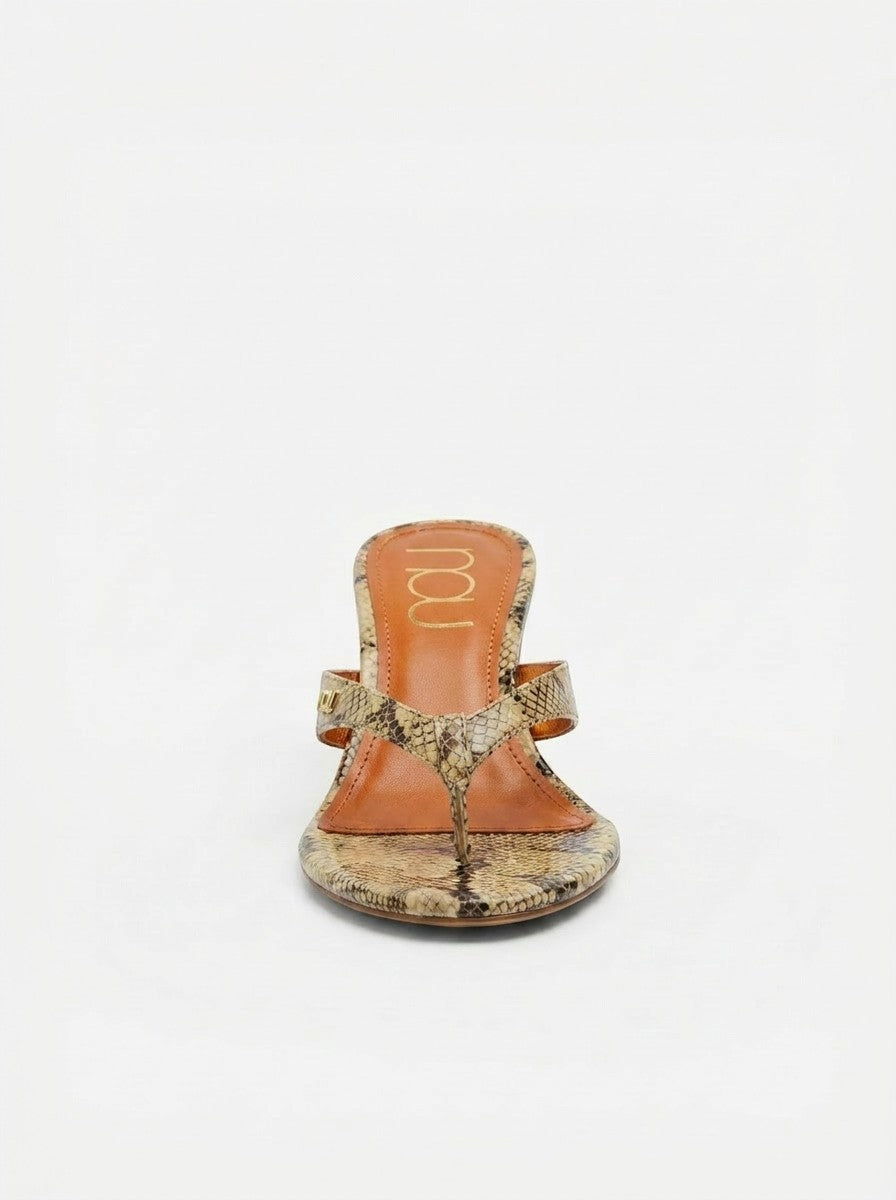 NOU The Puff Wedge thong sandals with python snakeskin upper and 3" sculptural lift. Metallic orange insole.