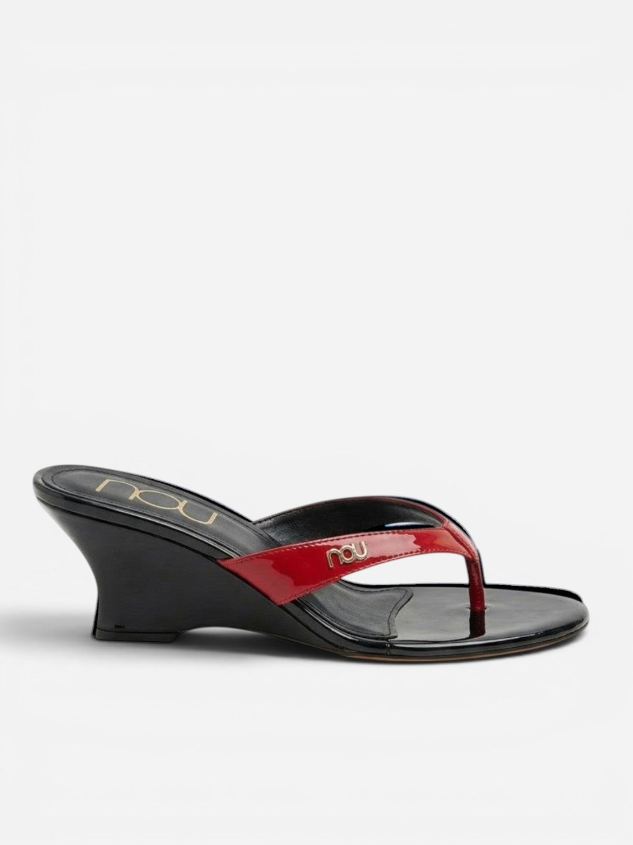NOU red patent leather thong wedge sandals with a black wedge heel and gold logo detail.