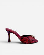 NOU red snakeskin finish leather mule heels with ruby gemstone accent and stiletto heel.