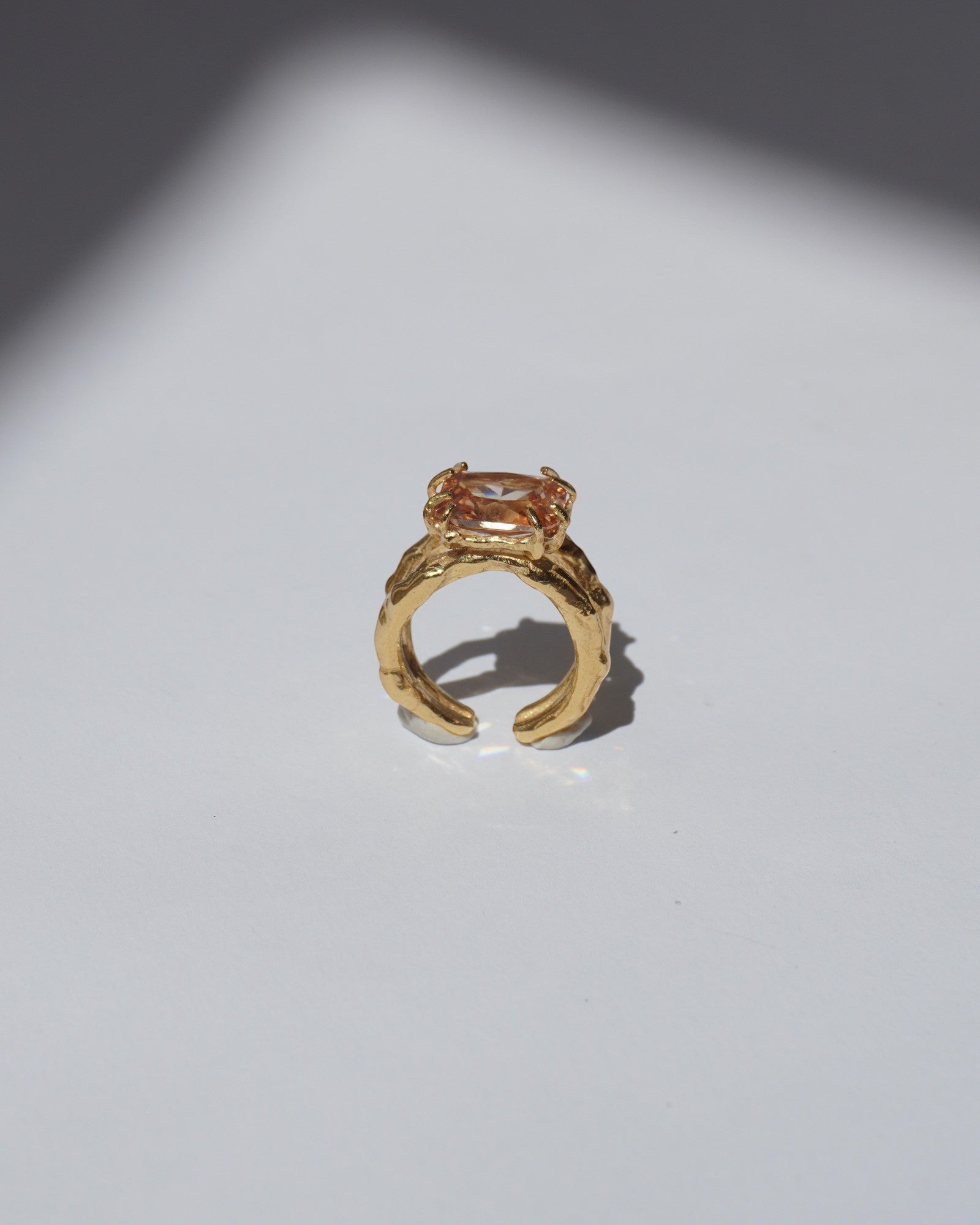 NOU Shoreline adjustable toe ring in 24K gold-plated sterling silver with a textured band and central stone.