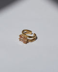 NOU Shoreline toe ring in 24K gold-plated sterling silver with a rectangular peach-toned stone and organic texture.
