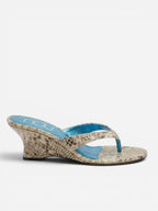 NOU women's silver snakeskin wedge sandals with blue insole and puffed straps. 3" heel.