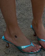 NOU The Kitty metallic blue kitten heel thong sandal with silver glitter heel and padded insole