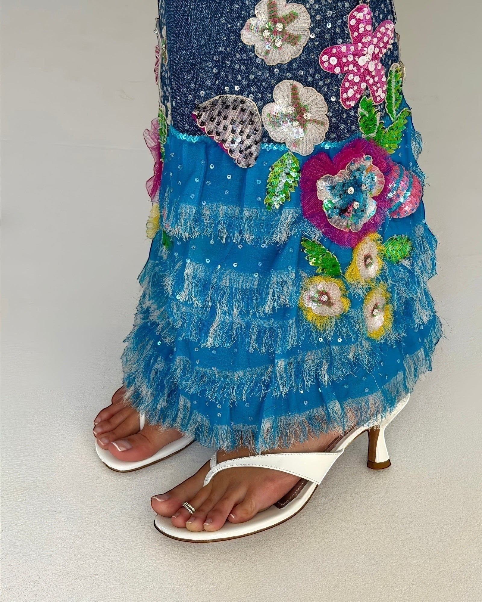 NOU The Kitty white coconut kitten heel sandals with sculpted straps and padded insole worn with a floral skirt