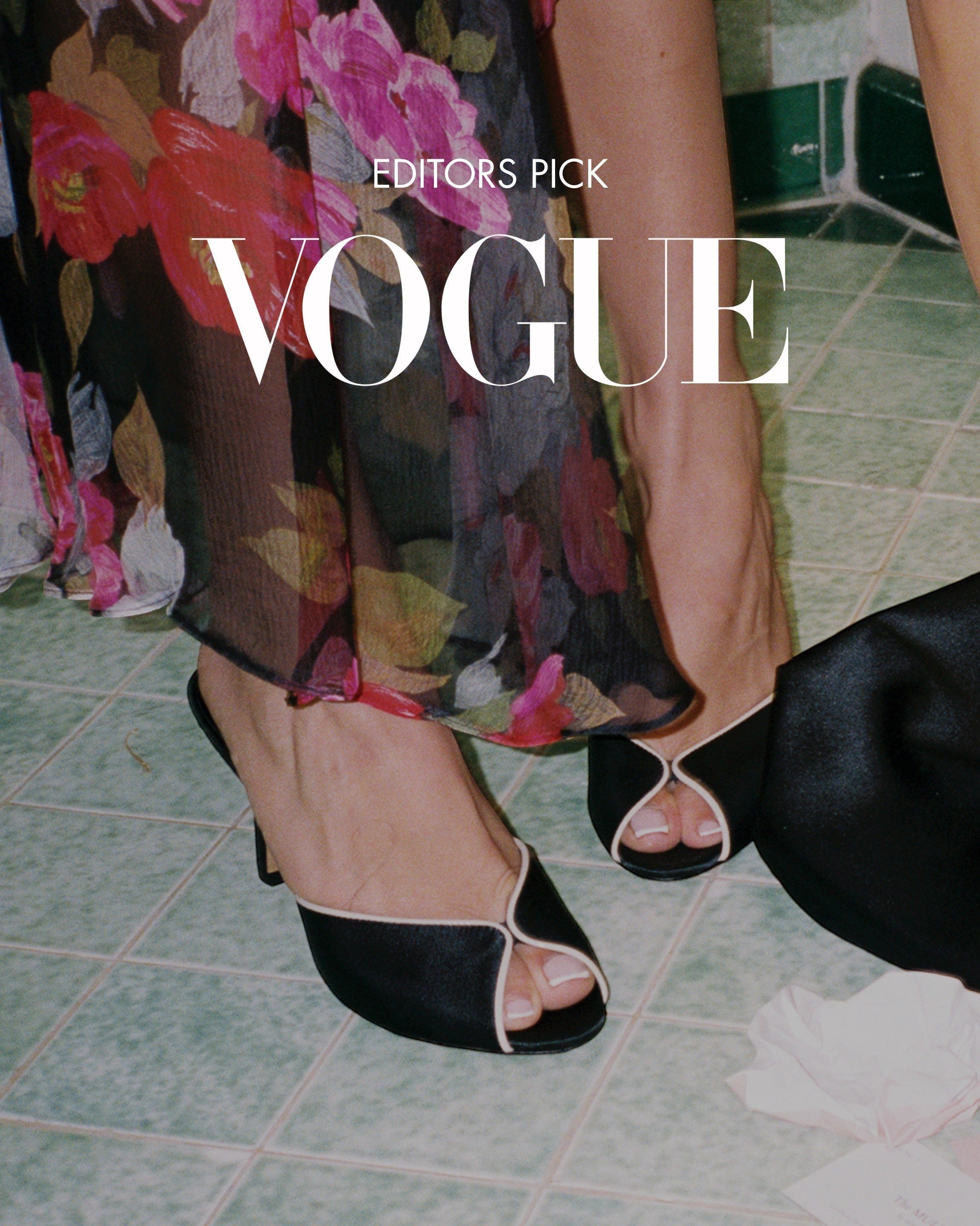 NOU The Mule black satin open-toe heels with cream leather trim and a 3-inch heel, worn by a model in a floral dress.