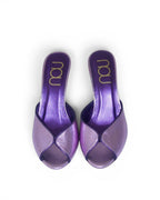 NOU The Mule special edition slip-on heels in ultraviolet metallic purple with a peep-toe design.