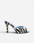 NOU black and white zebra print ponyhair mule with light blue lining and stiletto heel.
