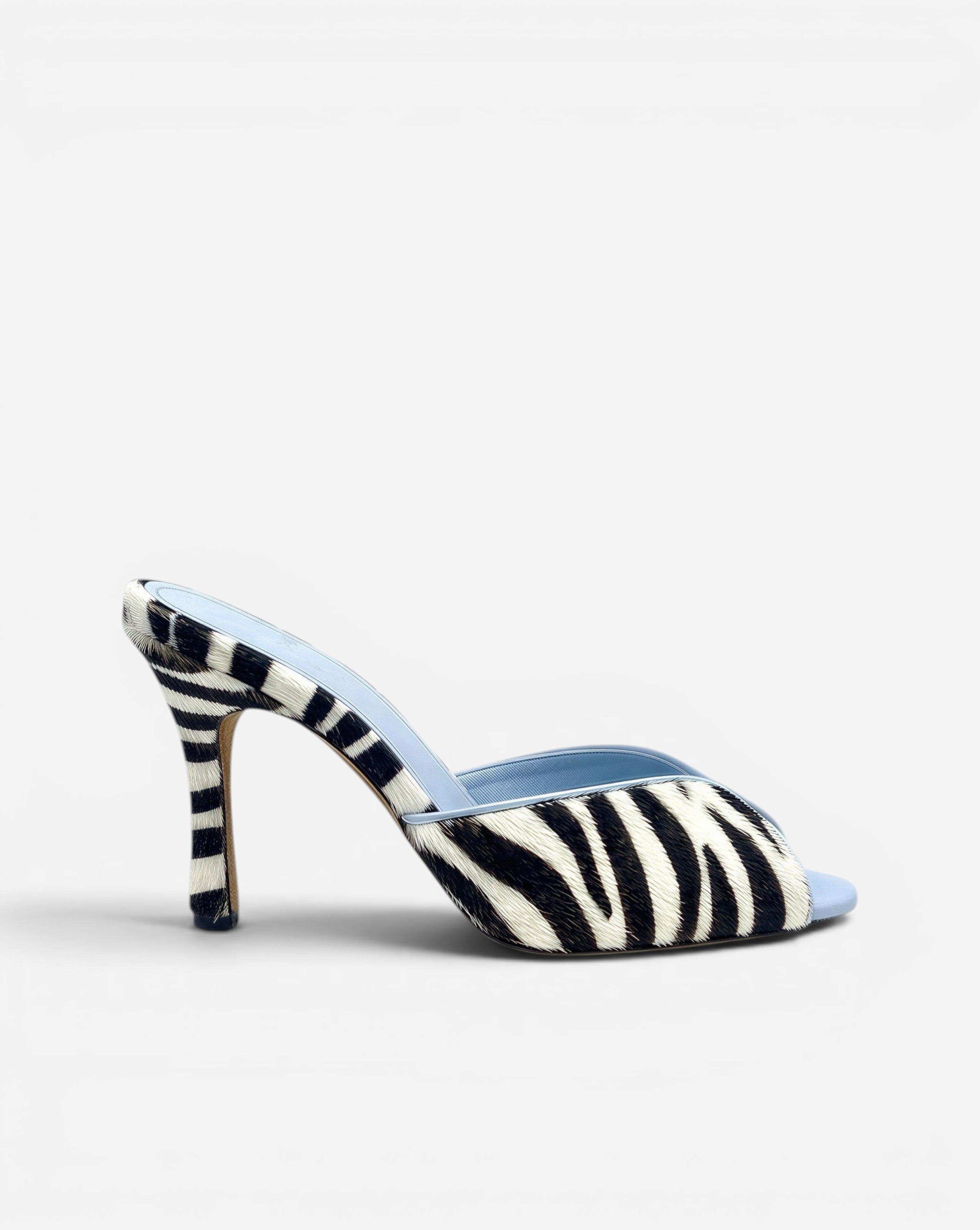 NOU black and white zebra print ponyhair mule with light blue lining and stiletto heel.