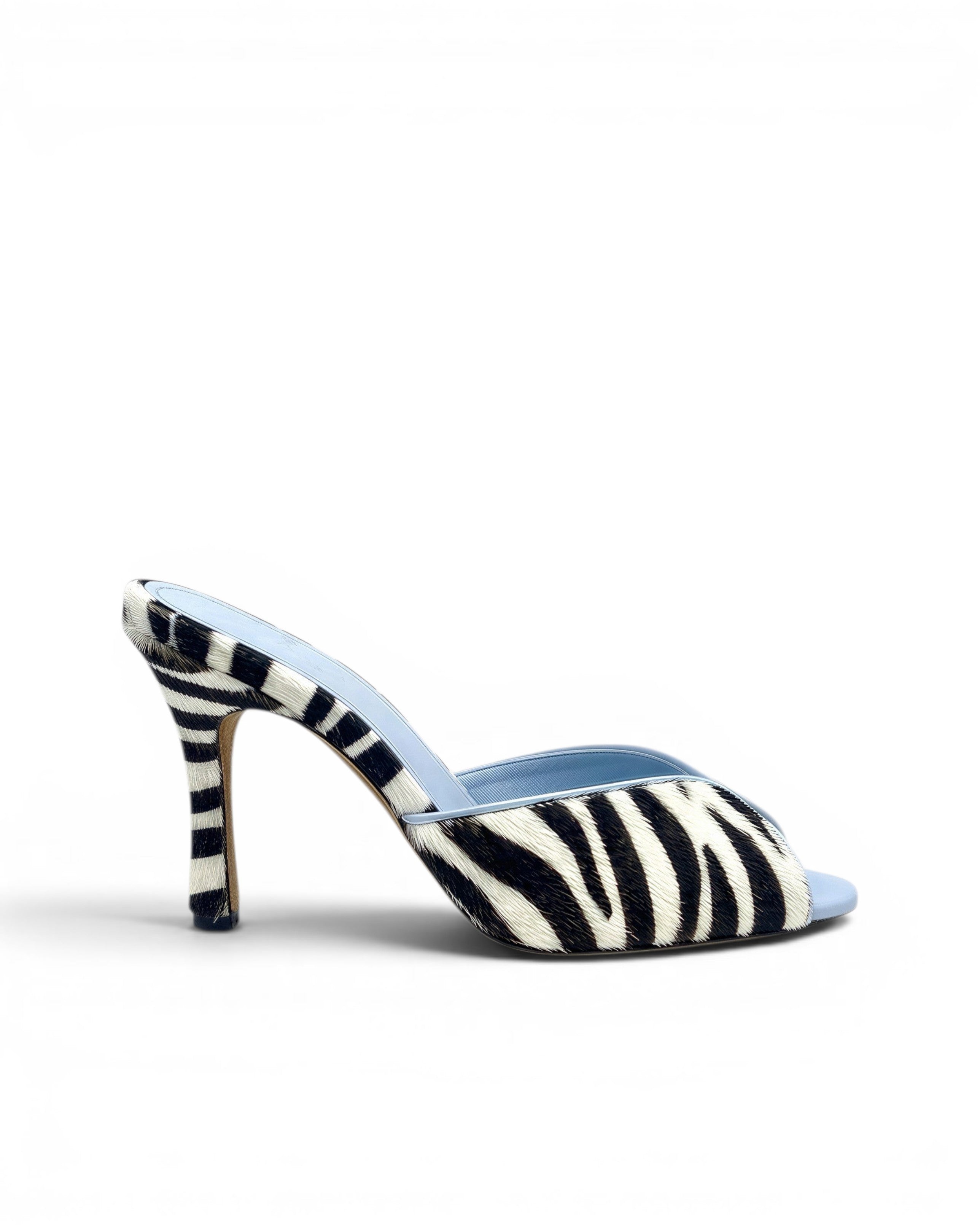 NOU black and white zebra print ponyhair mule with light blue lining and stiletto heel.