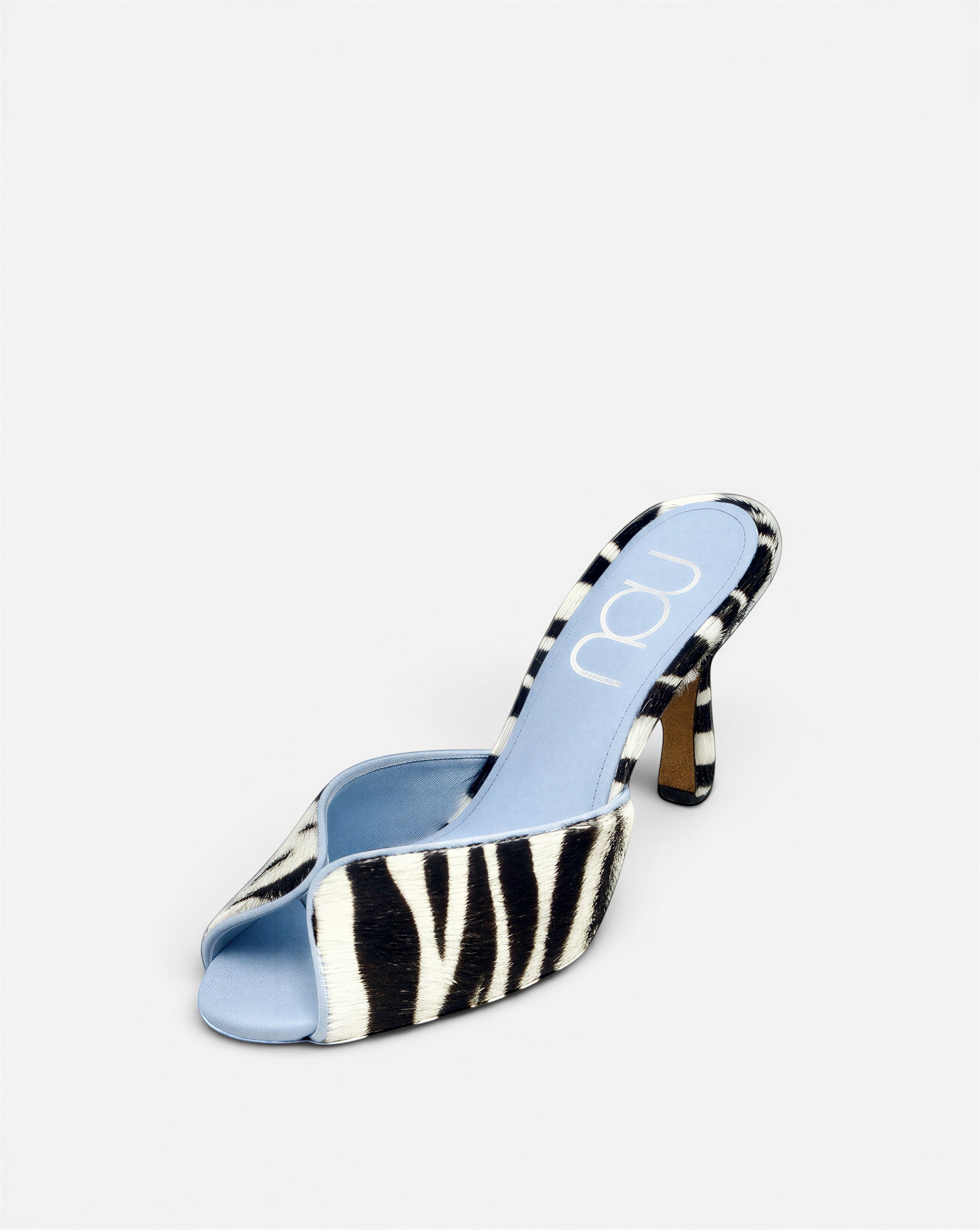 NOU zebra print ponyhair mule with light blue sole and stiletto heel.