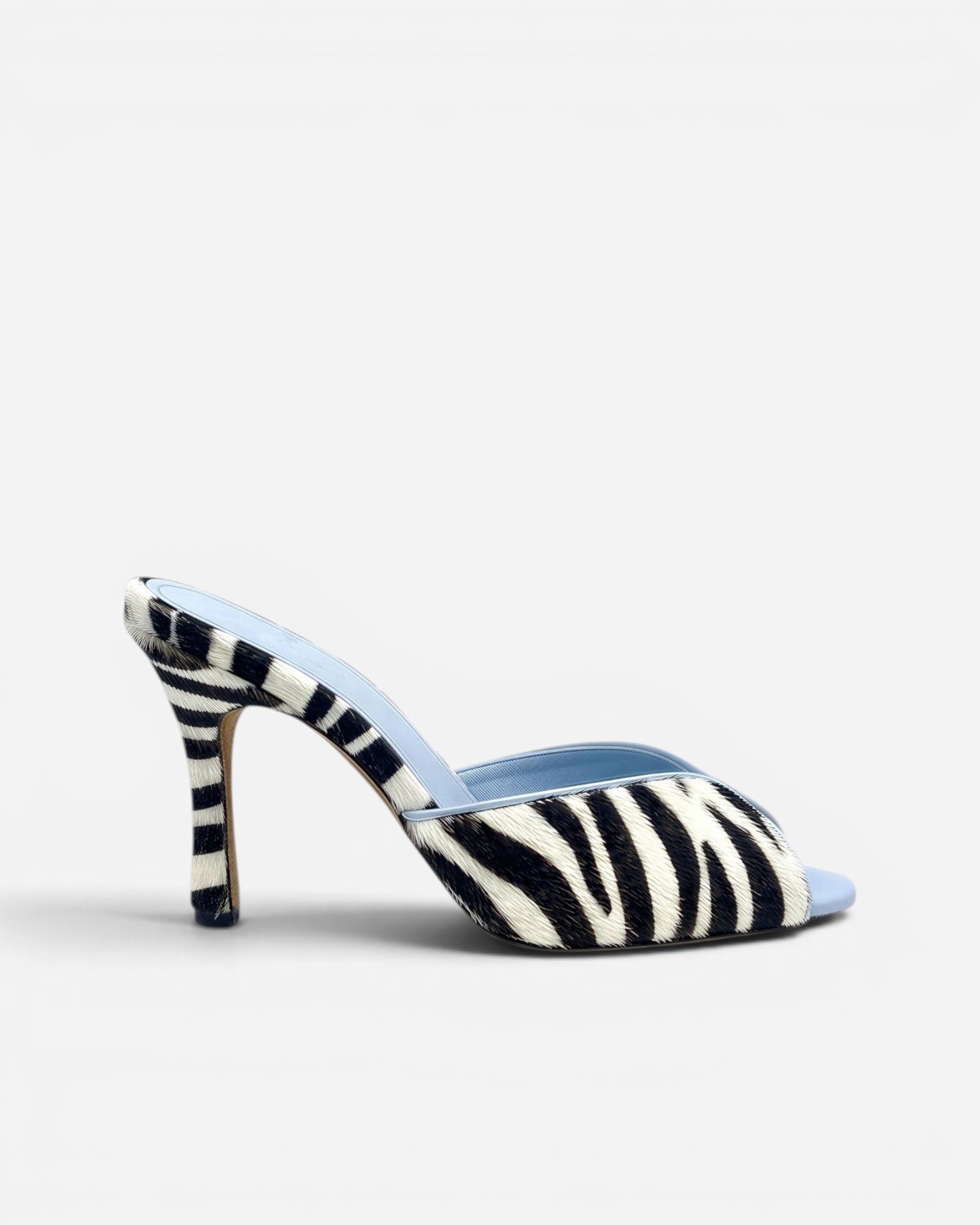 NOU The Mule in zebra-print Italian ponyhair with a light blue leather lining and high stiletto heel.