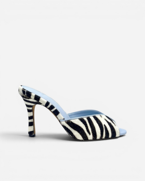 NOU The Mule in zebra-print Italian ponyhair with a light blue leather lining and high stiletto heel.
