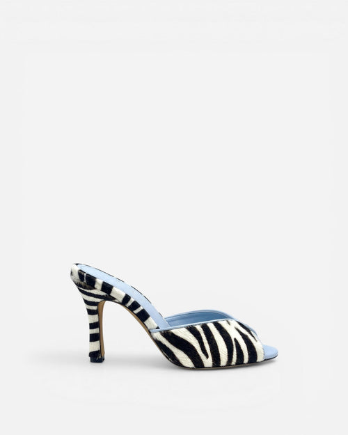 NOU black and white zebra print ponyhair mule with light blue lining and stiletto heel.