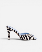 NOU The Mule in zebra print ponyhair with a light blue interior and high heel, side view.