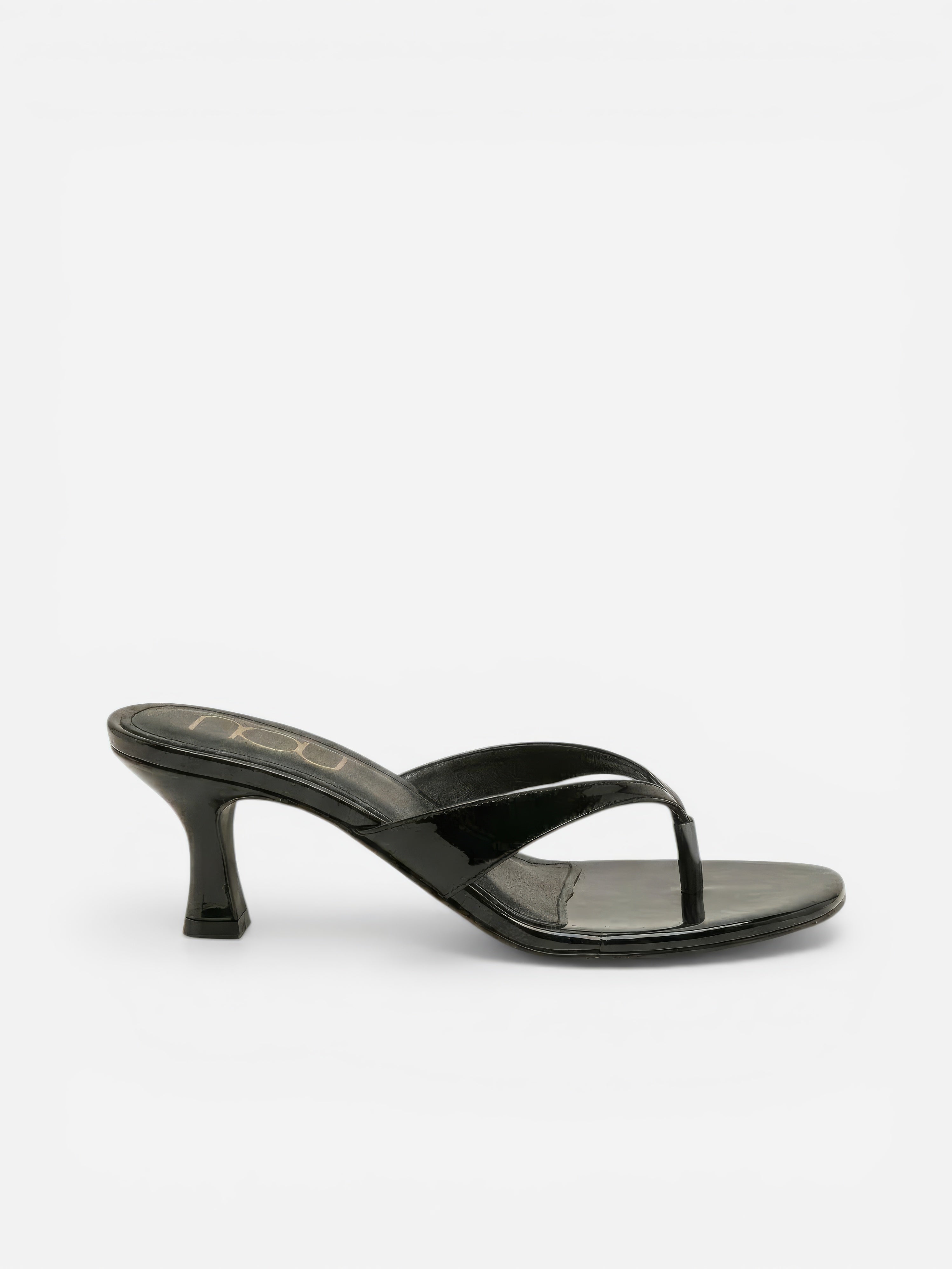 Black sandal with a thin strap on a white background